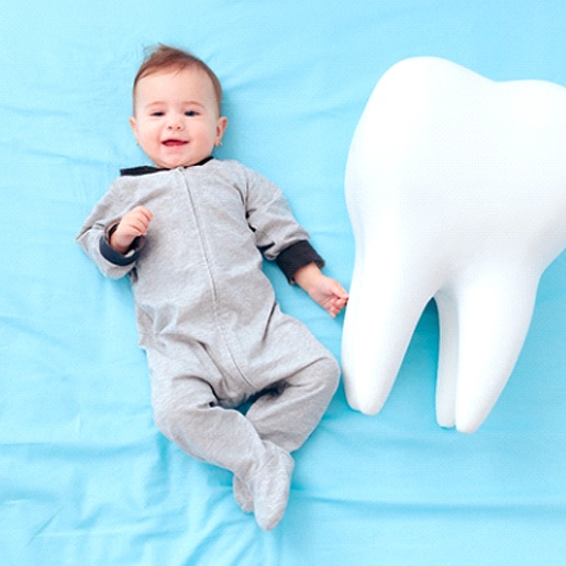 Baby and model tooth in Willow Park