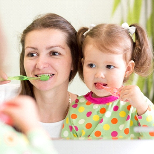 Mom and daughter brushing teeth in Willow Park