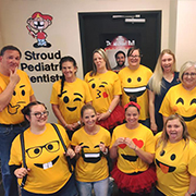 Team members at nighttime fun run with glow necklaces