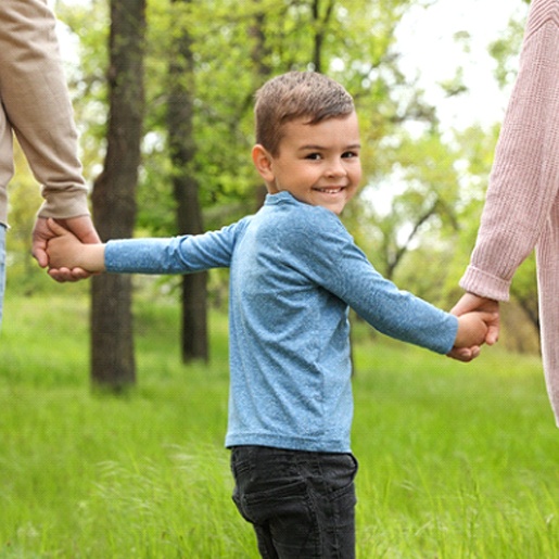 Boy with parents after Delta Dental children’s dentist in Willow Park