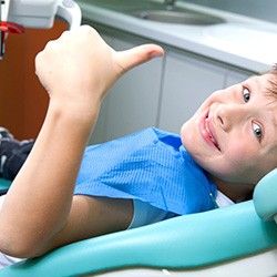 child giving thumbs up while visiting dentist in Willow Park