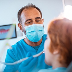 Dentist examining a child’s smile