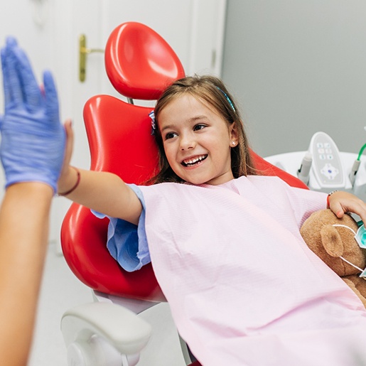 Child giving a dentist a high-five