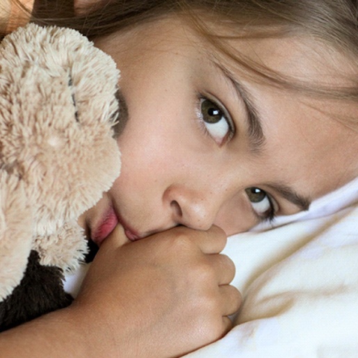 Young girl with stuffed animal, engaging in non-nutritive habits in Willow Park