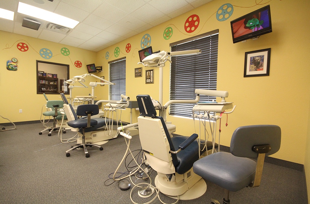 Room with three dental treatment chairs