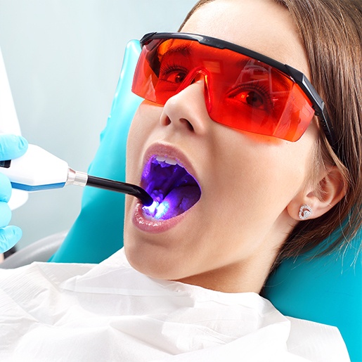 Young woman receiving dental sealants