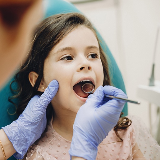 Child receiving dental exam