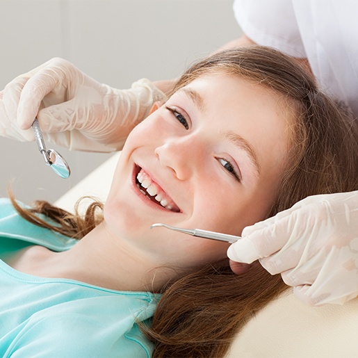 Smiling child during dental treatment