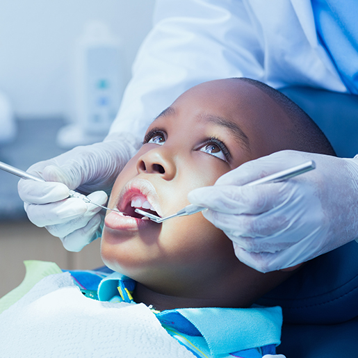 Child receiving dental treatment