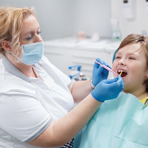 A little girl preparing for silver diamine fluoride treatment in Willow Park