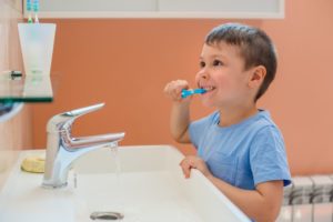 child brushing his teeth during cold and flu season in aledo