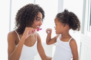 child smiling after naturally preventing cavities