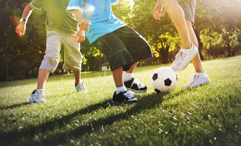 children playing sports outdoors