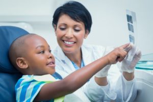 Smiling child visiting his Willow Park pediatric dentist